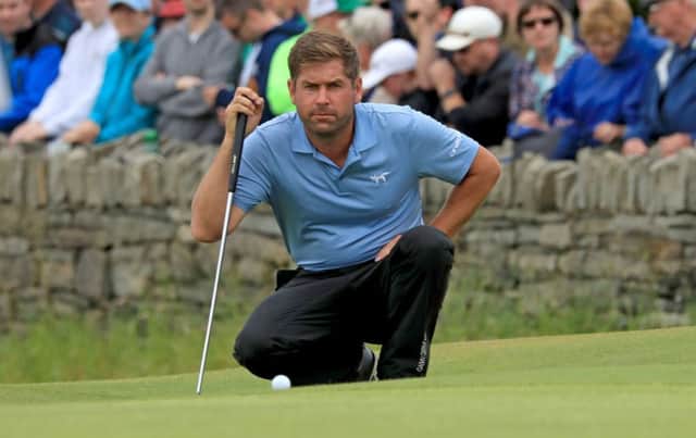 Robert Rock lines up his putt for a round of 59 in the Irish Open. Picture: Donall Farmer/PA Wire