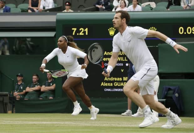 Serena Williams and Andy Murray race towards the ball. Picture: Tim Ireland/AP