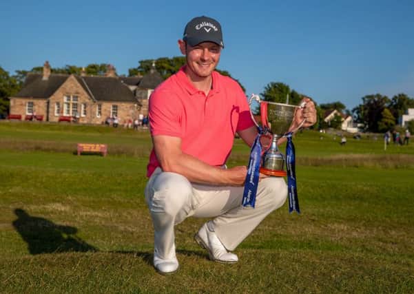 Scott Henry with his trophy for winning the Aberdeen Standard Investments Scottish Open Qualifier at Longniddry. Picture: Kenny Smith