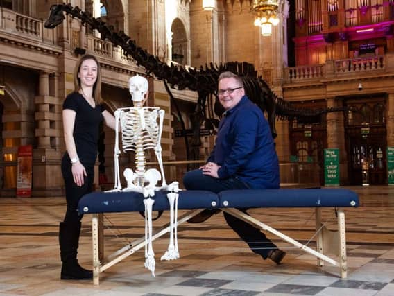 Clarkston Chiropractic owner Derek Leitch with chiropractor Laura Sutherland and Dippy the Dinosaur. Picture: Contributed