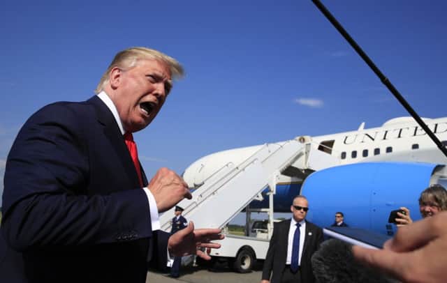 President Donald Trump speaks at Morristown Municipal Airport in Morristown, N.J., on their way returning back to the White House Sunday, July 7, 2019. (AP Photo/Manuel Balce Ceneta)