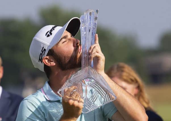 Matthew Wolff kisses the trophy after winning the 3M Open. Picture: Andy Clayton/AP