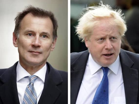 Jeremy Hunt (left) and Boris Johnson. Picture: AP