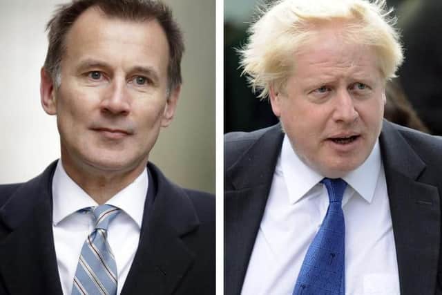 Jeremy Hunt (left) and Boris Johnson. Picture: AP