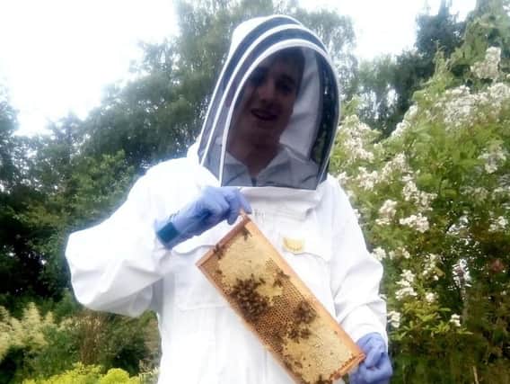 Martin Leahy, 15, started looking after bees when he was just nine-years-old when he started going along to his local club with mum Sarah, 52. Picture: SWNS