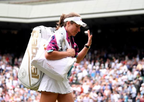 Johanna Konta walks off the Centre Court after losing to Barbora Strycova. Picture: Laurence Griffiths/Getty
