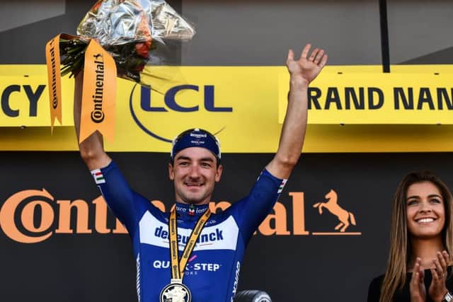 Italian spirnter Elia Viviani celebrates his stage victory on the podium in Nancy. Picture: Jeff Pachoud/AFP/Getty