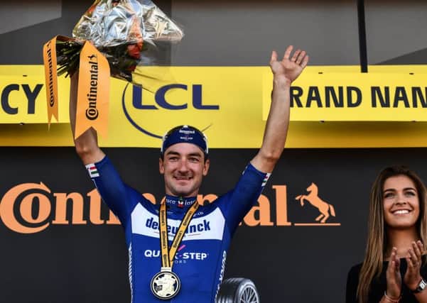 Italian spirnter Elia Viviani celebrates his stage victory on the podium in Nancy. Picture: Jeff Pachoud/AFP/Getty
