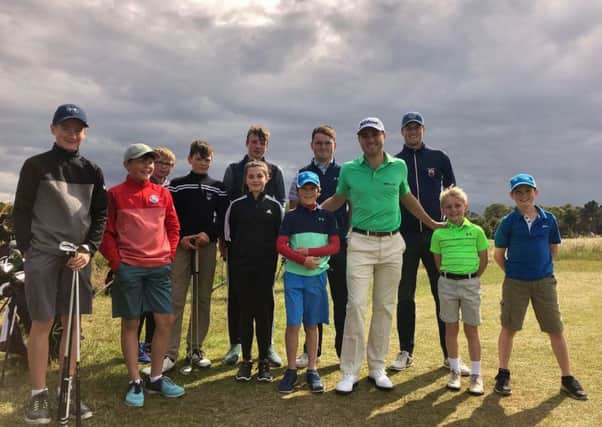 Justin Thomas meets some of the local juniors