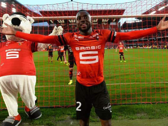 James Lea Siliki celebrates with the Rennes fans after a victory