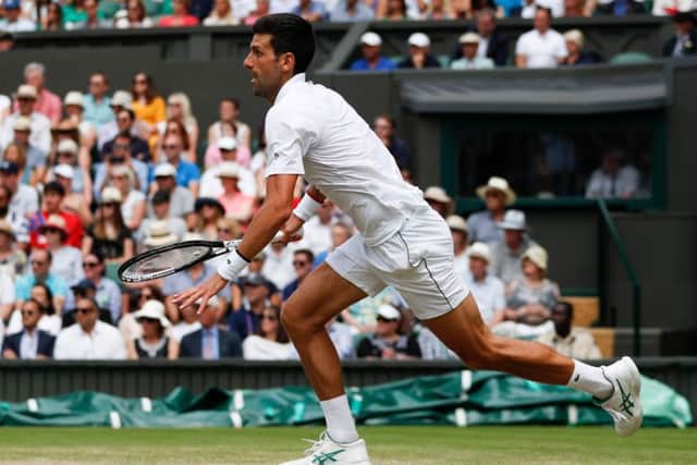 Serbia's Novak Djokovic runs to make a return against Belgium's David Goffin. Picture: Adrian Dennis/AFP/Getty