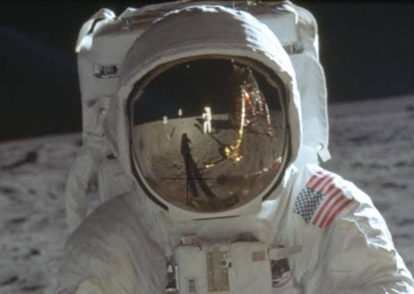Astronaut Neil Armstrong is seen reflected in the helmet visor of Buzz Aldrin on the surface of the moon (Picture: Neil Armstrong/Nasa via AP)