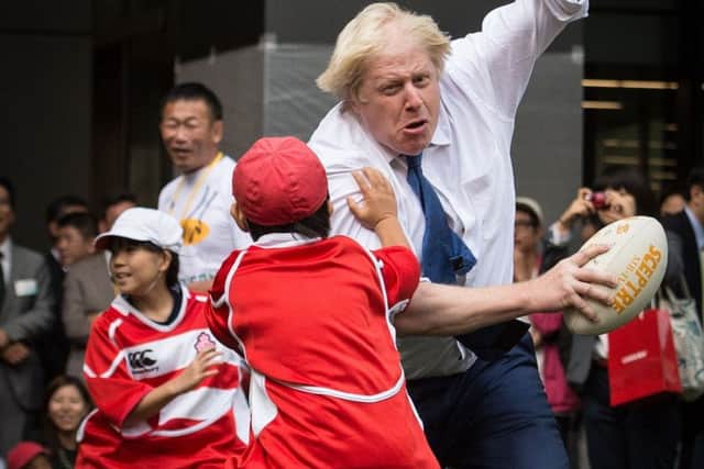 Johnson barged into Toki Sekiguchi, 10, while playing rugby in Tokyo in 2015. Toki said he felt a little bit of pain but its OK (Picture: Stefan Rousseau/PA)