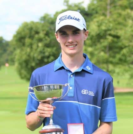 Cameron Adam shows off the trophy after his win on home turf at Royal Burgess. Picture: Scottish Golf