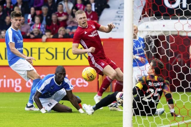 Aberdeen striker Sam Cosgrove slips the ball past RoPS goalkeeper Antonio Reguero to make it 2-0. Picture: Gary Hutchison/SNS