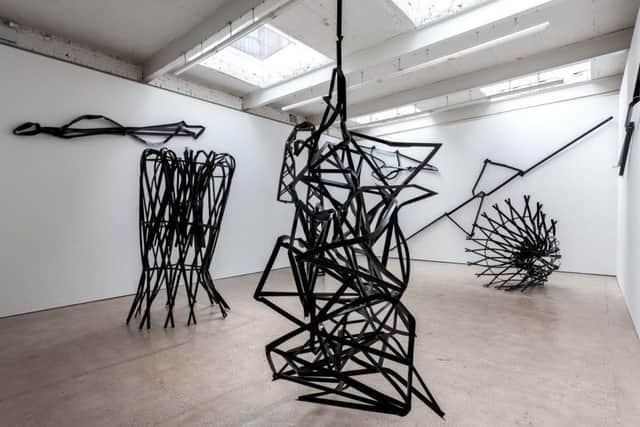 Monica Sosnowska makes Soviet-influenced metal lattice structures then forcibly distorts them