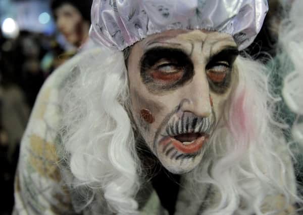 Parades in Sitges are a bit different to many in Scotland, as this man, dressed as a member of the living dead takes part in a Zombie Walk, demonstrates (Picture: Josep Lago/AFP/Getty Images)