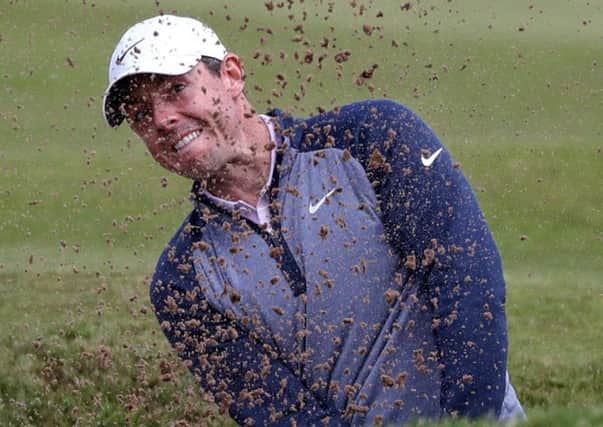 Rory McIlroy plays out a bunker at the 12th hole. Picture: Jane Barlow/PA Wire