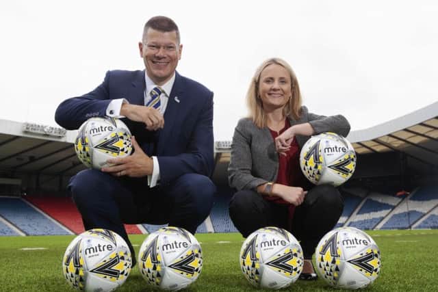 SPFL chief executive Neil Doncaster donated 100 Mitre Delta Max Plus footballs to women's chief executive Fiona McIntyre. Picture: Ross Brownlee/SNS
