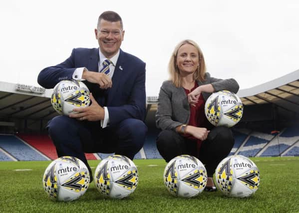 SPFL chief executive Neil Doncaster donated 100 Mitre Delta Max Plus footballs to women's chief executive Fiona McIntyre. Picture: Ross Brownlee/SNS