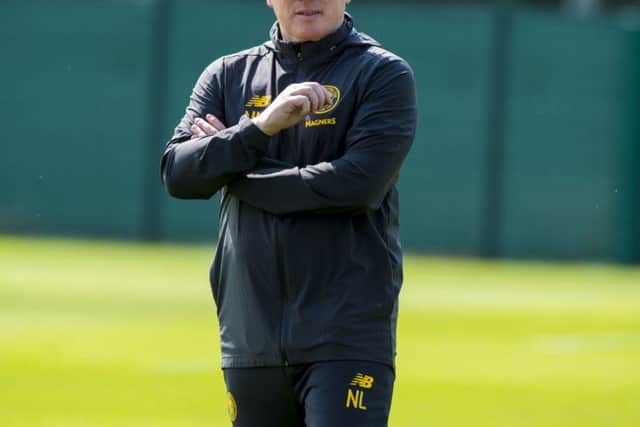 Lennon keeps a close eye on training at Lennoxtown. Picture: SNS Group
