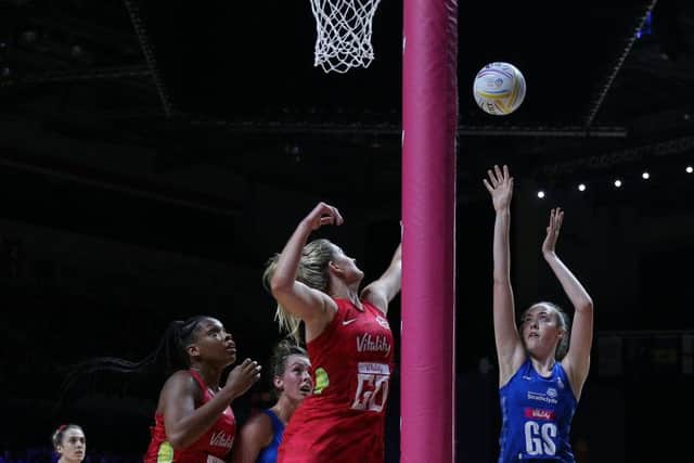 Scotland's Emma Barrie shoots during the Netball World Cup match against England in Liverpool. Picture: Nigel French/PA Wire