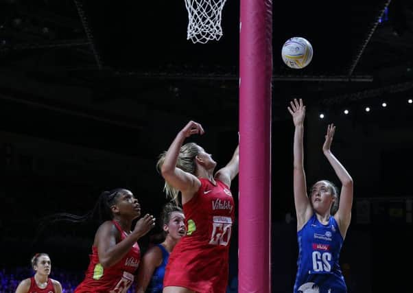 Scotland's Emma Barrie shoots during the Netball World Cup match against England in Liverpool. Picture: Nigel French/PA Wire