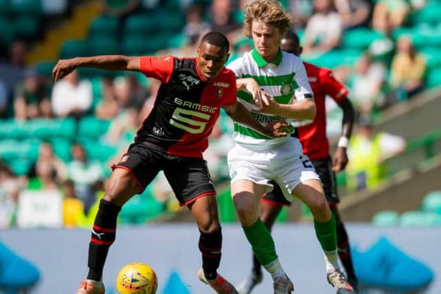 Luca Connell vies for the ball with Armand Lauriente