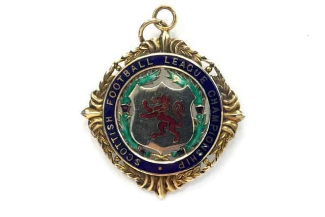 Scottish Football League Championship medal from 1964, won by Rangers captain Bobby Shearer during Ranger's treble-winning season.