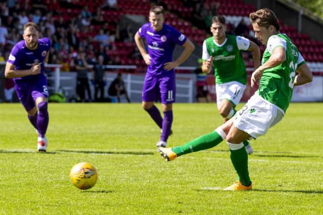 Scott Allan, now in his third spell with Hibs, slots home his penalty to put the vistors ahead just before half-time. Picture: SNS