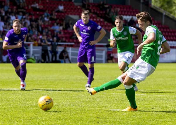Scott Allan, now in his third spell with Hibs, slots home his penalty to put the vistors ahead just before half-time. Picture: SNS