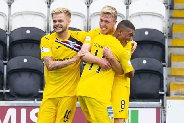 Tom Beadling celebrates after making it 3-0 to the Pars. Picture: SNS