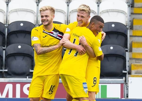 Tom Beadling celebrates after making it 3-0 to the Pars. Picture: SNS