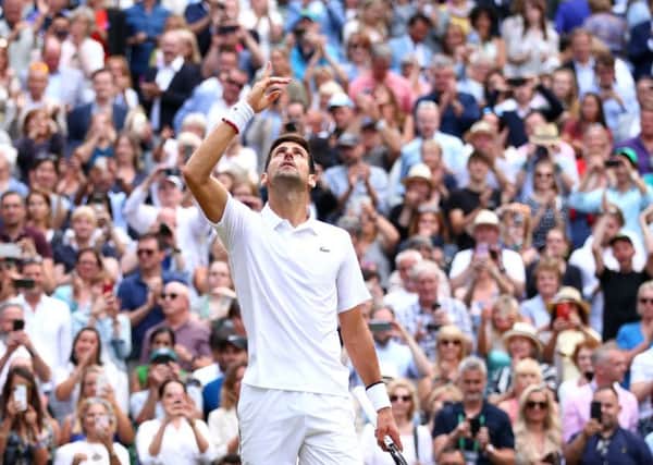 Novak Djokovic celebrates winning the men's singles final against Roger Federer at Wimbledon. Picture: Clive Brunskill/Getty Images