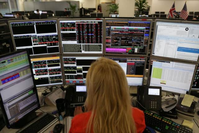 Shares in Scottish companies listed on the FTSE and Aim underperformed against the indexes in the first six months of 2019, according to analysis from Brewin Dolphin. Picture: AFP/Getty Images