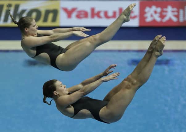 Grace Reid and Katherine Torrance of Great Britain in the women's 3m synchro springboard final in Gwangju. Picture: Lee Jin-man/AP
