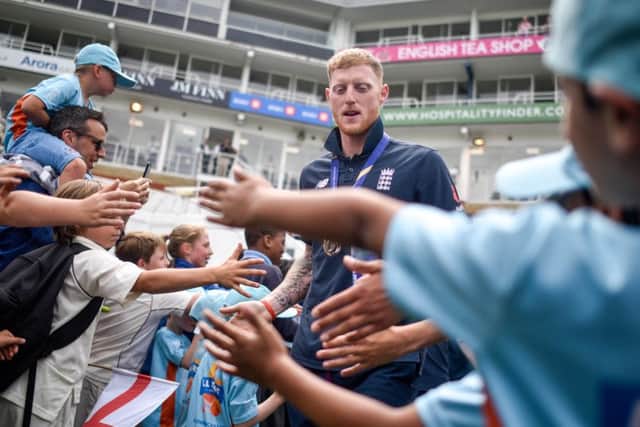 Ben Stokes high-fives school children during the England victory celebration at The Oval in London