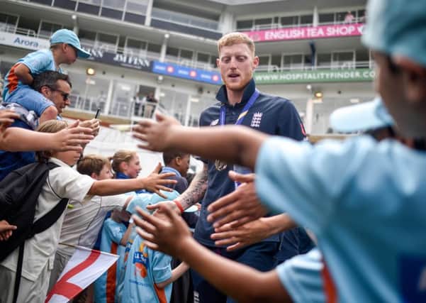 Ben Stokes high-fives school children during the England victory celebration at The Oval in London