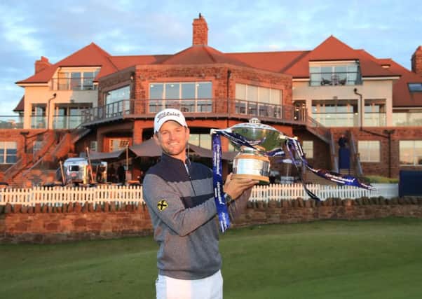Austrian Bernd Wiesberger  with the Scottish Open trophy following victory  at The Renaissance Club.
