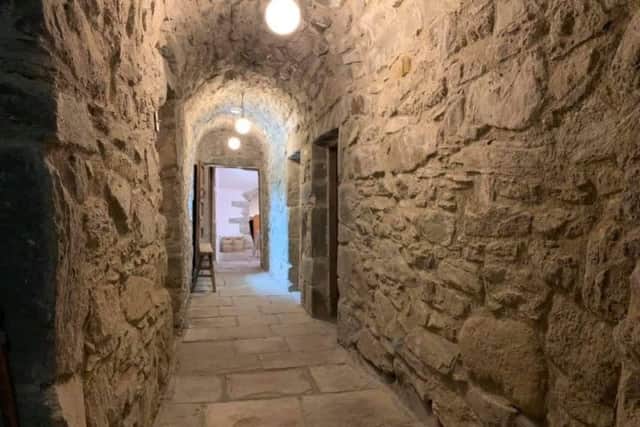 A hallway of original stone.