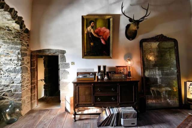 Guests can enjoy listening to music from the vintage record player in the living room.