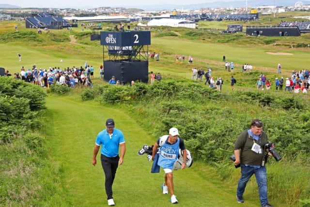 Brooks Koepka and his caddy Ricky Elliott during a practice round at Royal Portrush. Picture: Richard Sellers/PA Wire