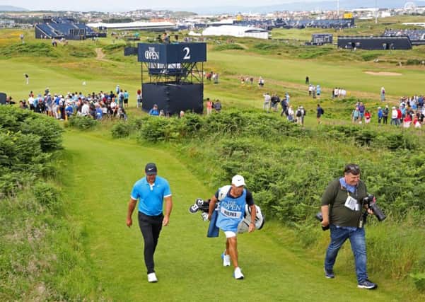 Brooks Koepka and his caddy Ricky Elliott during a practice round at Royal Portrush. Picture: Richard Sellers/PA Wire
