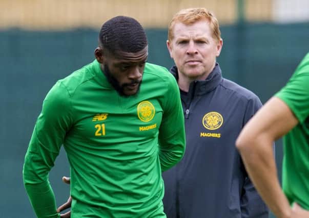 Olivier Ntcham trains under the watchful eye of manager Neil Lennon. Picture: Craig Williamson/SNS