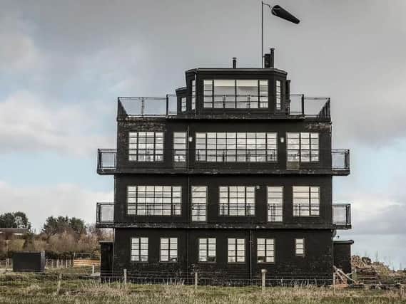 You can stay in the top room  of a control tower with wraparound balcony in this unusual property. Picture: AirBnB