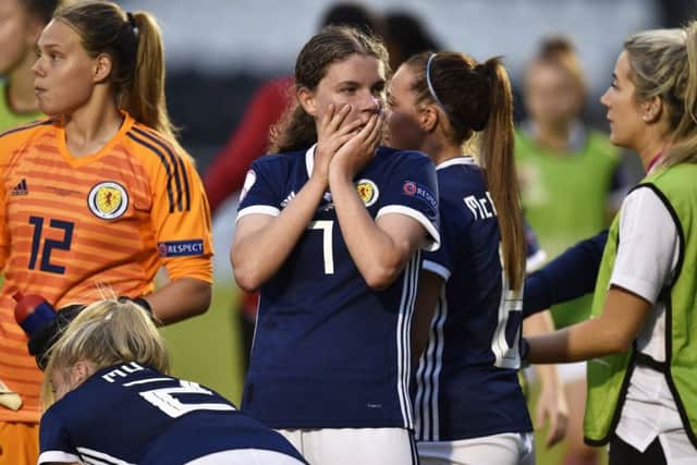 Kirstie McIntosh, centre, cuts a dejected figure after Scotland U19s hopes of earning a draw were dashed by a late French strike.