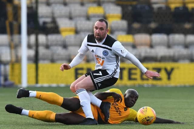 Livingston's Cece Pepe challenges Ayr United's Michael Moffat. Picture: Craig Foy/SNS