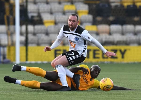 Livingston's Cece Pepe challenges Ayr United's Michael Moffat. Picture: Craig Foy/SNS