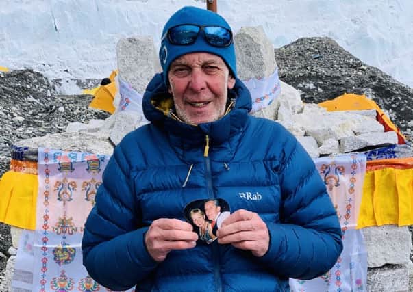Alan Sinclair, with a photo of his wife, at Everest base camp