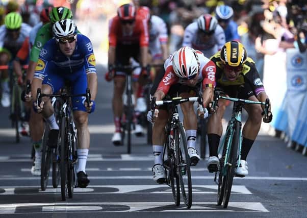 Caleb Ewan, centre, beats Dylan Groenewegen, right, and Elia Viviani, left, to the line in Toulouse. Picture: Anne-Christine Poujoulat/AFP/Getty